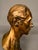 A distinguished 19th-century bronze male bust, signed A. Q. Harise on the reverse and dating to circa 1840. The sculptural...