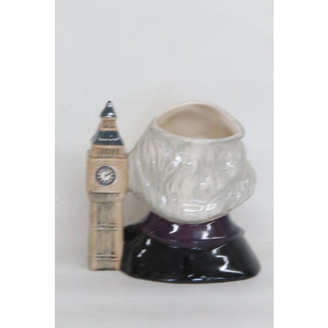 This charming character mug is made of porcelain. This interesting toby jug is titled John Doulton with a style number of...