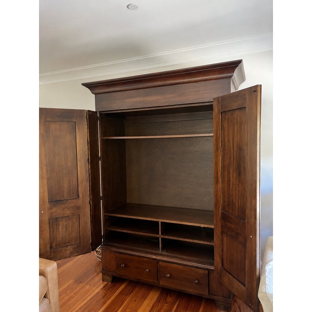 Beautiful solid walnut entertainment armoire by Room & Board, handcrafted by RomWeber Furniture in Batesville, Indiana....