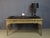 A rare louis xv style desk in wood and gilt stucco, dating from the 19th century. This desk rests on four cabriole legs...