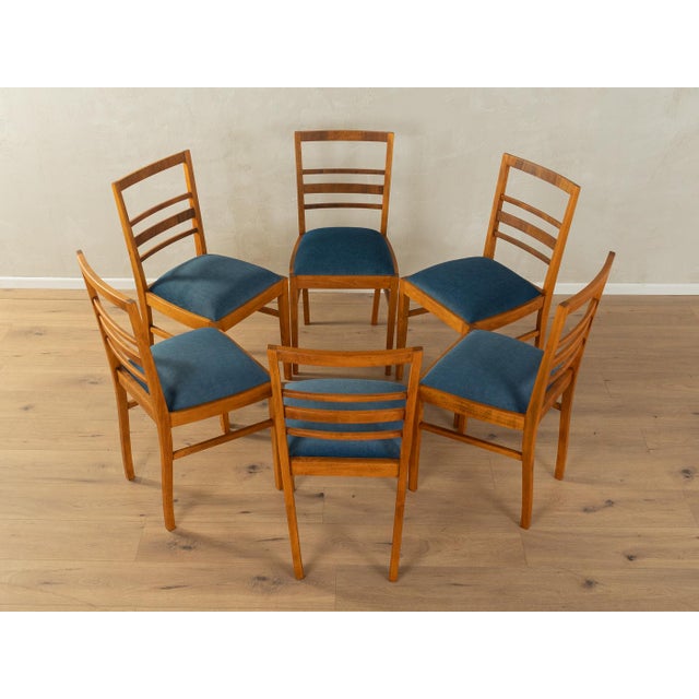 Classic Art Deco dining chairs from the 1930s. Solid beech frame stained teak. The original spring core has been...