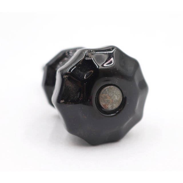 Vintage cabinet or drawer knob made of black glass with a fluted shape. The original mounting nuts are included. Good...