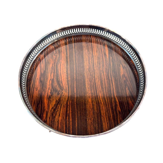 A Mid-Century Sheffield Silver serving tray featuring a pierced gallery edge, decorative cast feet, and its original faux...