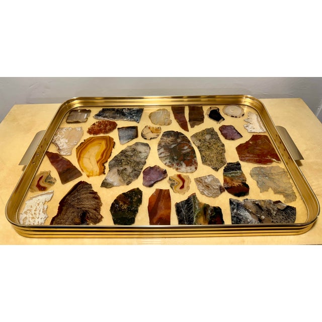 This vintage Italian serving tray in a brushed brass metal contains multiple slices of stone specimens set in a usable and...