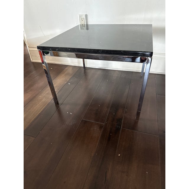 Black Marble Side or Coffee table on a polished chrome base originally designed by Florence Knoll in 1954 and produced by...