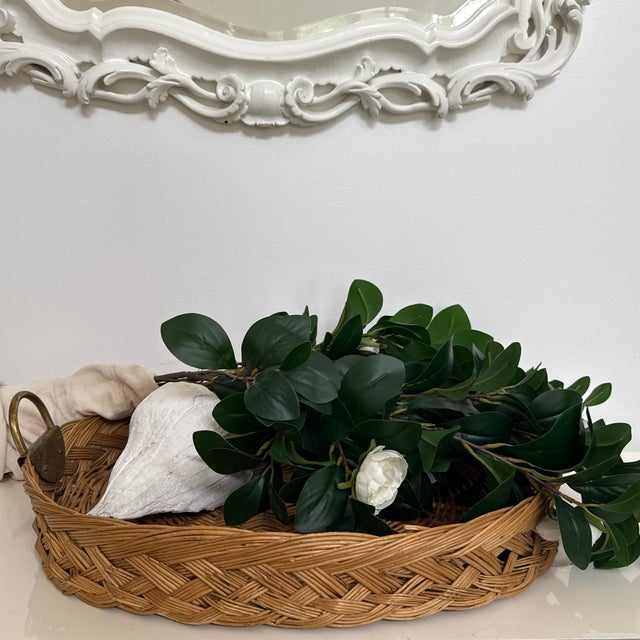Romantic woven basket with details. Brass handles with braided wooden basket. The metal handles complements each other the...