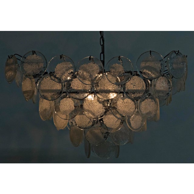 A lot of fun and just a bit flirty, the Scala chandelier features overlapping discs of glass suspended from minimally...