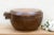 This large, lidded wooden bowl is a testament to the soul of craftsmanship. A Philippine tribal vessel from the mid-20th...