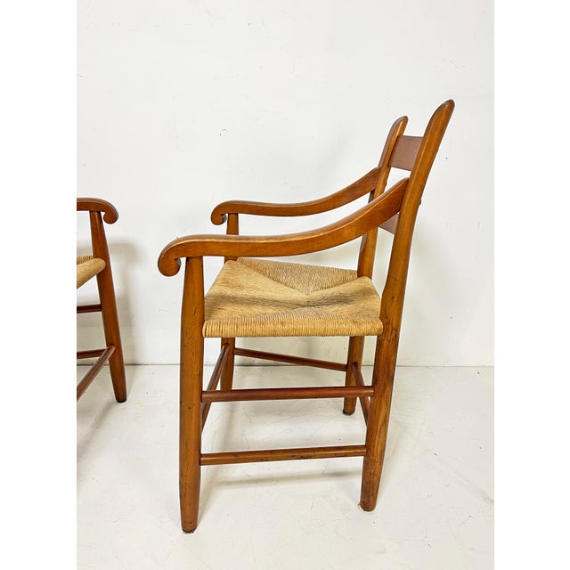 A pair of modernist influenced thumbback armchairs by the noted Cambridge, MA artisan Charles Webb. Fashioned from solid...