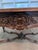 This elegant French Louis XV style table features sophisticated cabriole legs and intricate hand carved rococo detailing,...