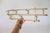 Vintage brass plated coat & hat wall mounted rack. No makers mark. Some light age wear to brass plate finish.