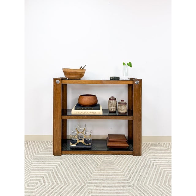 Add sleek, modern sophistication to your space with this vintage smoky glass 3-tier shelving unit. Featuring tinted glass...