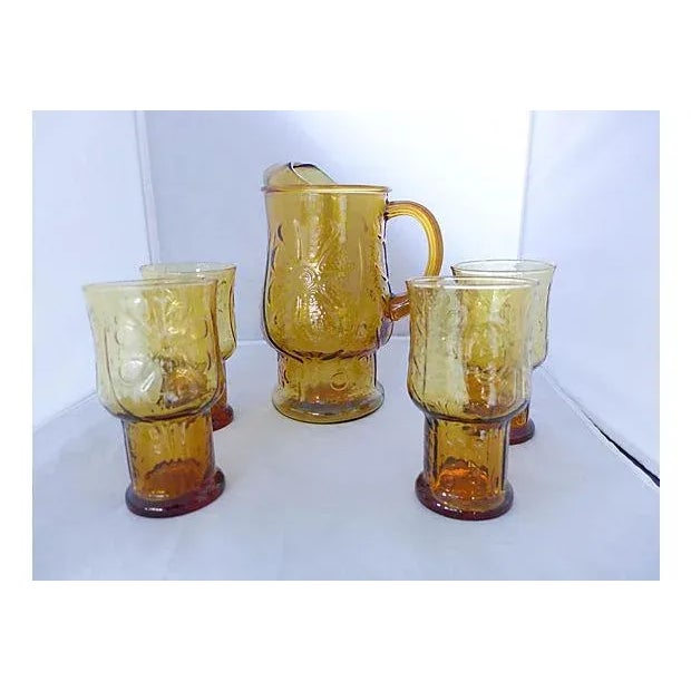 Vintage 5-Pieces of iced tea/ water service including pitcher and four tall glasses. Dimensions: pitcher, 7"Dia x 10"H;...
