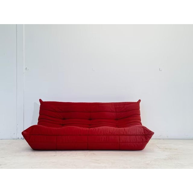 Manufacturer: Ligne Roset Designer: Michel Ducaroy Model: Togo Color: Red Dimensions: 3-seater sofa: 174 cm length x 102...