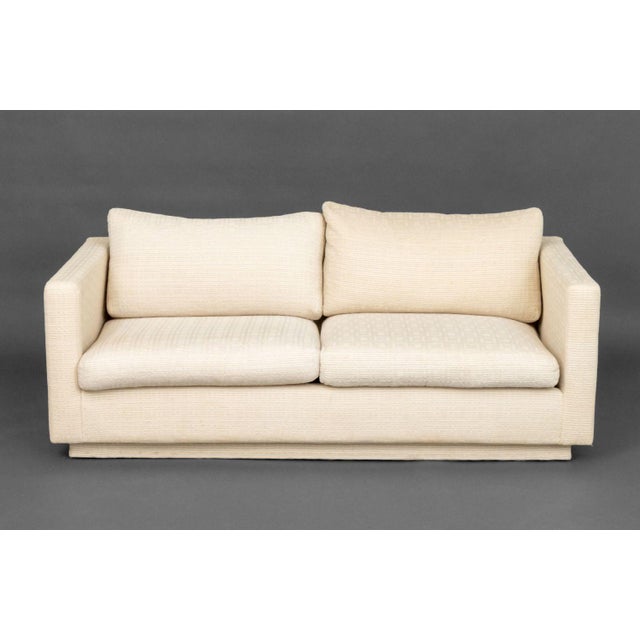 Modern White Upholstered Two-Seat Sofa. 28" H x 62.75" W x 35" D; seat: 15" H. Provenance: From the Estate of Gerard...