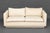 Modern White Upholstered Two-Seat Sofa. 28" H x 62.75" W x 35" D; seat: 15" H. Provenance: From the Estate of Gerard...