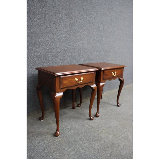 Pair of Henkel-Harris nightstands crafted from genuine mahogany, each with a single dovetailed drawer, brass bail...
