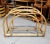 Mid-Century restored rattan double arched two-tiered glass shelf side table in a lighter blonde colored rattan. Circa...