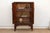 Four lobed medallions — a quatrefoil shape common to Qing-era decorative vocabulary — are painted across the two front...