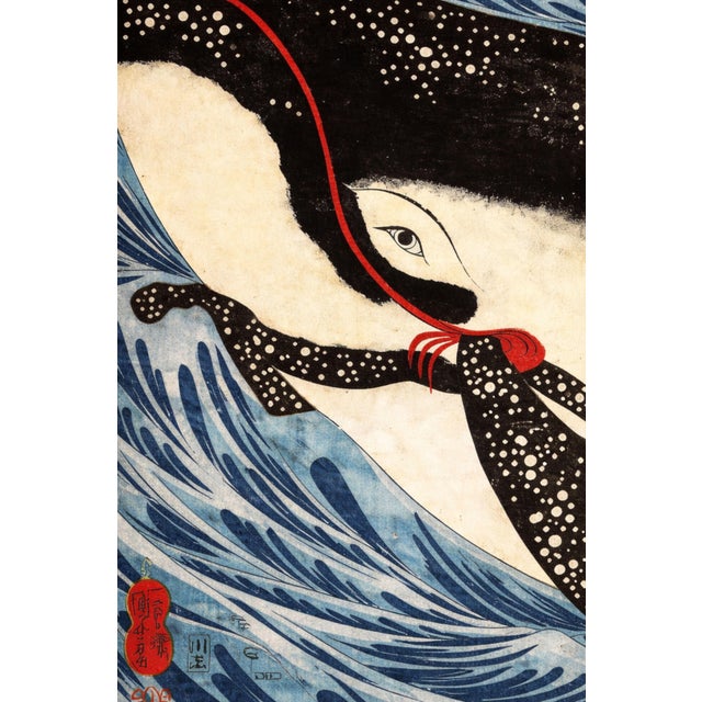 Vintage Japanese whale artwork from the 19th century, reproduced and refined for modern printing. This dramatic coastal...