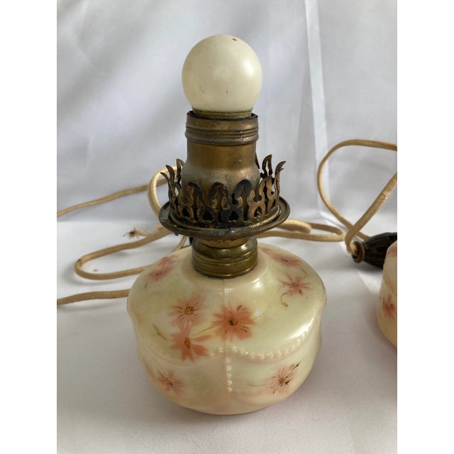 Very pretty victorian pink lamp set. These lamps are not functional, but could be used as decorative lamps.