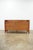 This Hooker Furniture media console features a clean-lined transitional design crafted in a rich cherry-toned finish with...