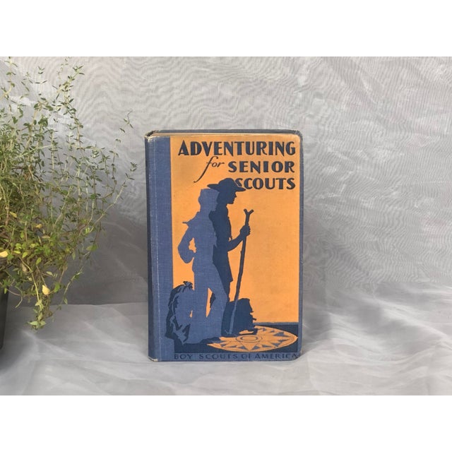 With its decorative blue and orange cover, this vintage Boy Scouts of America scouting guide would make an interesting...