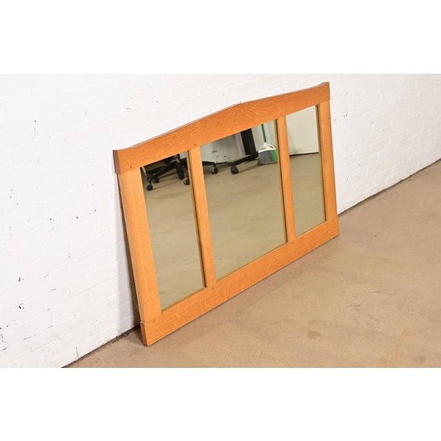 A gorgeous Mission oak Arts & Crafts triple wall mirror By L. & J.G. Stickley USA, Late 20th Century Measures: 54.75"W x...