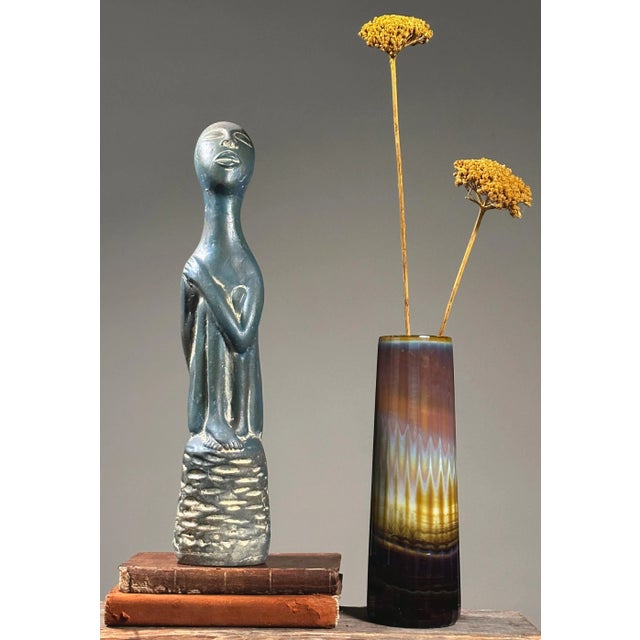 Vintage Modernist Polychrome Clay Seated Figurative Sculpture with Etched Detail. Seated figure with crossed legs sitting...