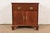 A beautiful Georgian or Chippendale style nightstand or end table By Baker Furniture USA, Circa 1980s Carved mahogany,...