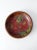 This is a mid 20th century vintage decorative bowl. The wood pyrography bowl features a poinsettia design with red, green,...