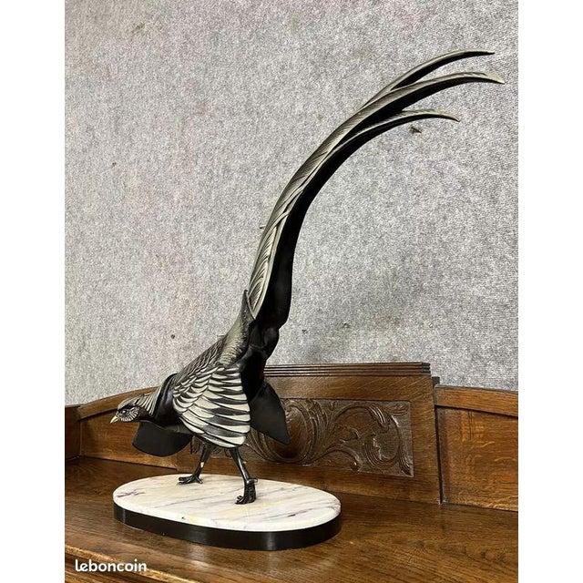 Rochard: Art Nouveau sculpture of a pheasant with a brown and silver patina Oval base in two tones (black and white)...