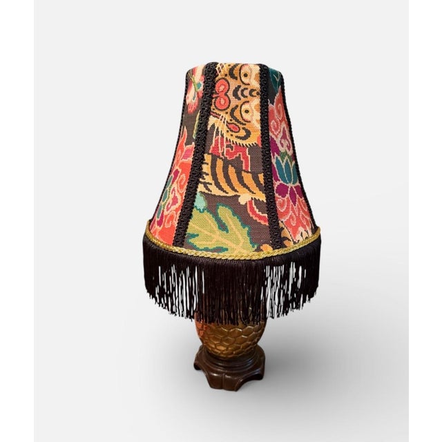 A richly patterned designer lampshade crafted from P. Kaufmann’s “Tiger Eye Basketweave Slate” fabric, featuring a vibrant...