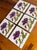 Set of six antique French Art Nouveau ceramic tiles, each hand-painted with an elegant pink poppy and flowing green...