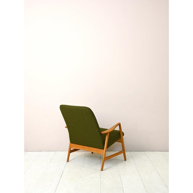 Original vintage armchair from the 1960s. This Swedish armchair designed by Alf Svensson features a solid oak structure...