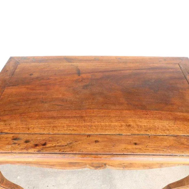 DETAILS A small, antique French tall side / end table with rectangular overhanging top over a serpentine apron and slender...