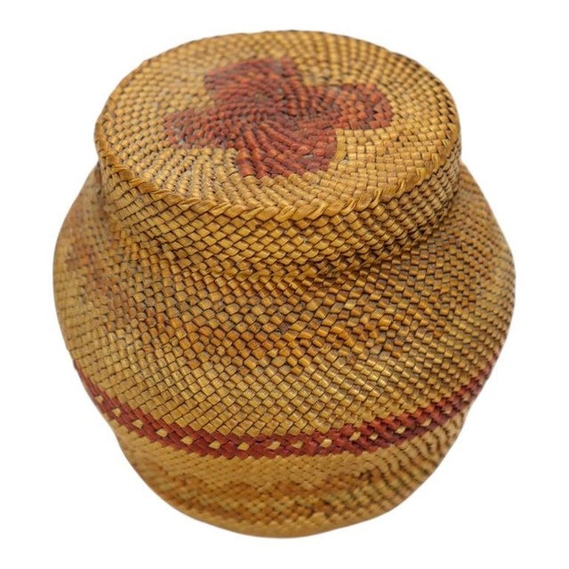 This antique Makah woven bulbous lidded basket originates from the Pacific Northwest Native American tradition, dating to...