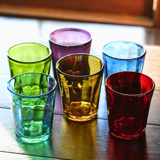 A palette of shiny colors for the table, with a multitude of reflections. Bei tumblers are handmade by using the flying...