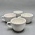 This listing includes a set of four heavy-duty beige ceramic coffee cups featuring a classic, rounded diner style. These...