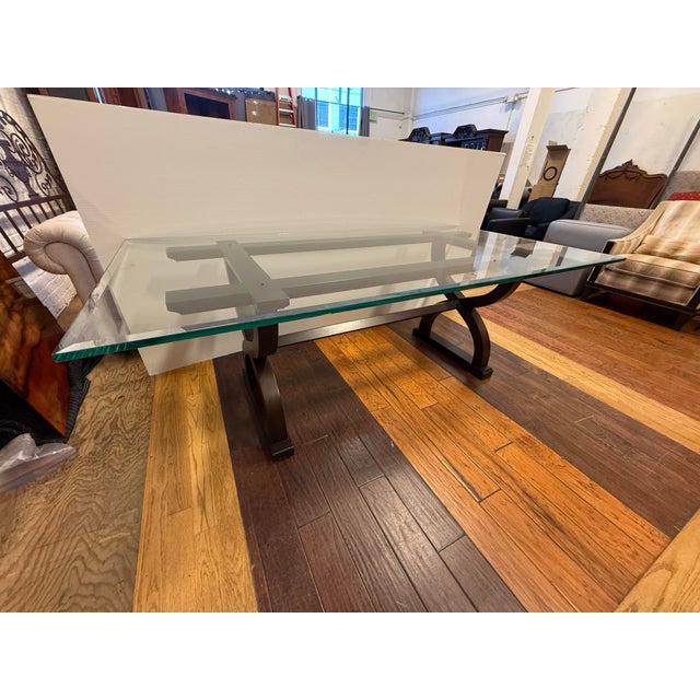Design Plus Gallery presents a Contemporary Sculptural Trestle Wood & Glass Dining Table. This distinctive table pairs a...