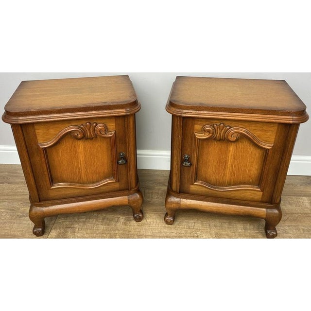 This elegant pair of Vintage French Louis bedside tables offers classic French styling with practical cupboard storage....