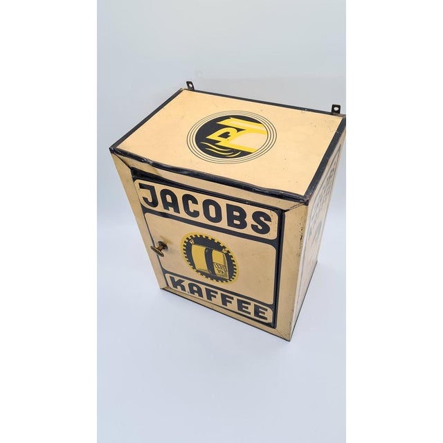 This vintage Jacobs Kaffee advertising tin from the 1930s was designed for displaying and storing coffee in colonial...