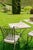 Alnilam is an outdoor table with a travertine top and metal frame, made in Italy, distinguished by its compact proportions...