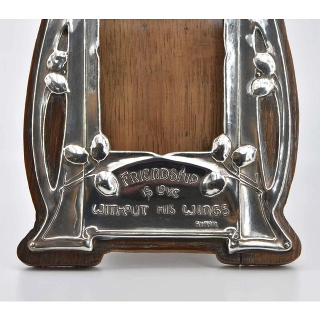 A wonderful silver plated Art Nouveau small easel photograph frame with oak backing. Embossed with Byron verse 'Friendship...