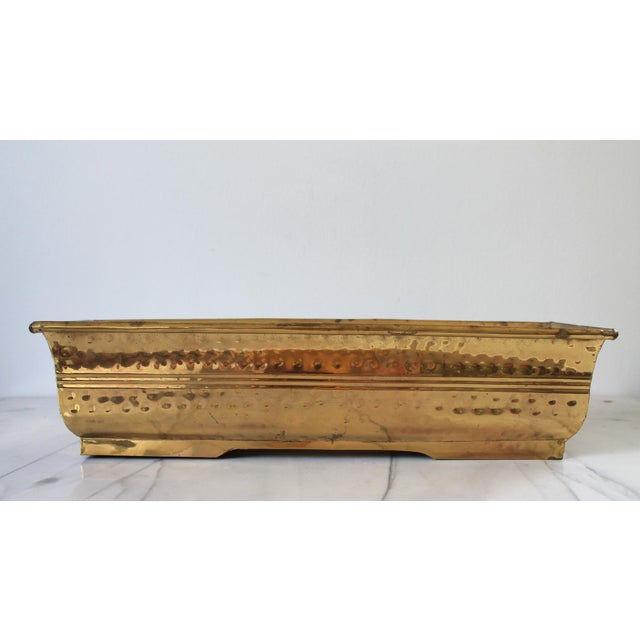 Vintage rectangular hammered brass planter. No makers mark. Age wear, a little wobbly, patina, dents.