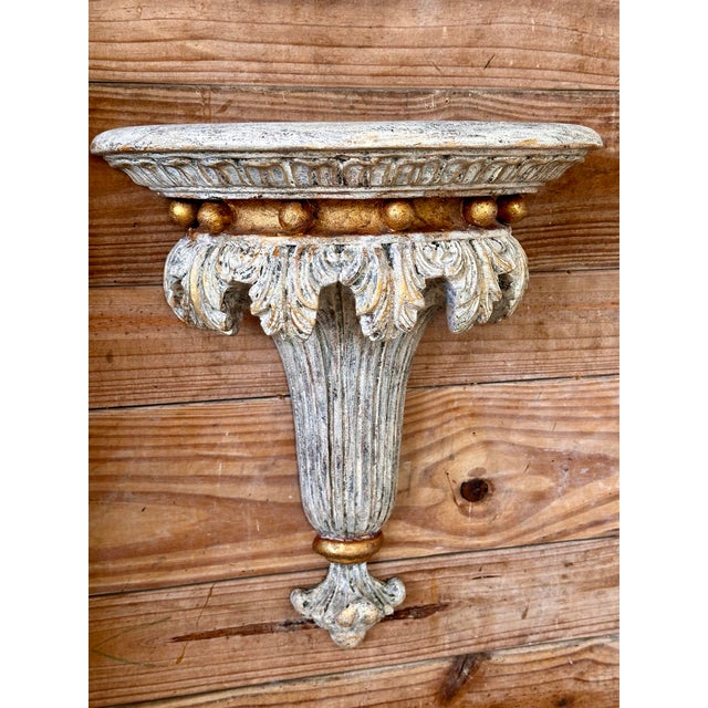 Accentuate your decor with this exquisite pair of sculptural rolled acanthus leaf wall brackets, featuring a timeless...