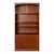 A classic mid-century Danish teak bookcase cabinet, combining elegant open shelving with practical concealed storage....