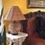 Vintage natural rattan table lamp featuring a woven globe-form base and matching tapered basket-weave shade. The...