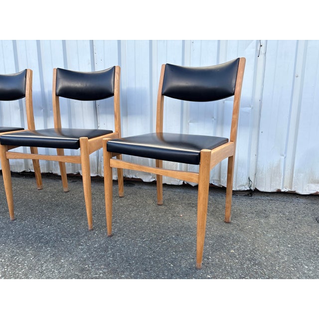 Elegant set of four Scandinavian dining chairs, dating from the 1960s–1970s. Crafted from light-toned solid wood, these...
