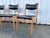 Elegant set of four Scandinavian dining chairs, dating from the 1960s–1970s. Crafted from light-toned solid wood, these...
